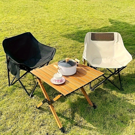 Folding camping chair with storage pocket