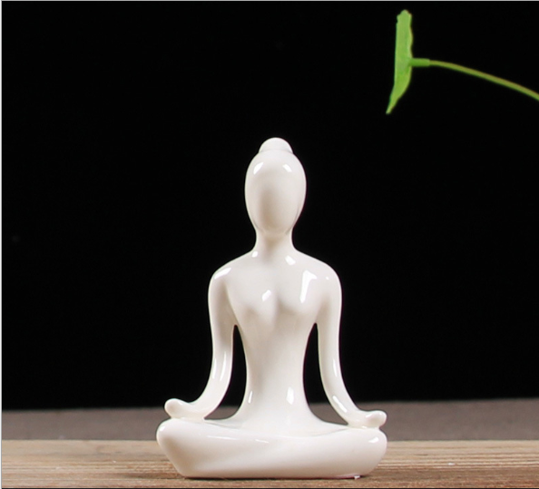 Ceramic figures in lotus pose