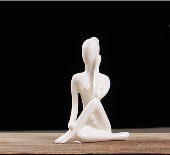 Ceramic figures in lotus pose