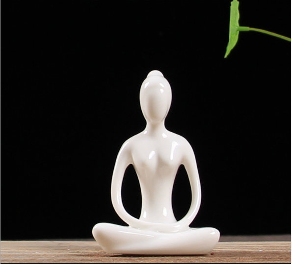 Ceramic figures in lotus pose