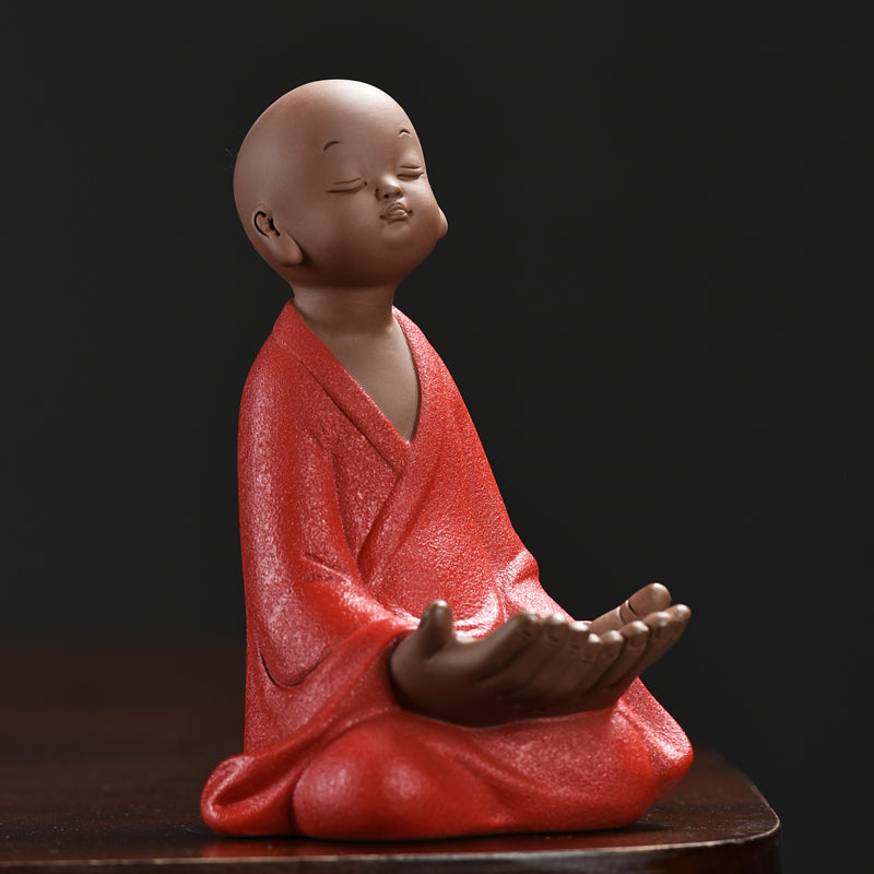 Little monk with a phone stand