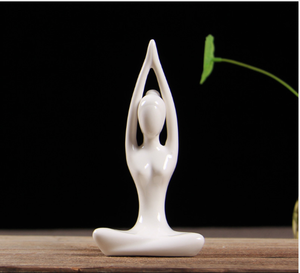 Ceramic figures in lotus pose