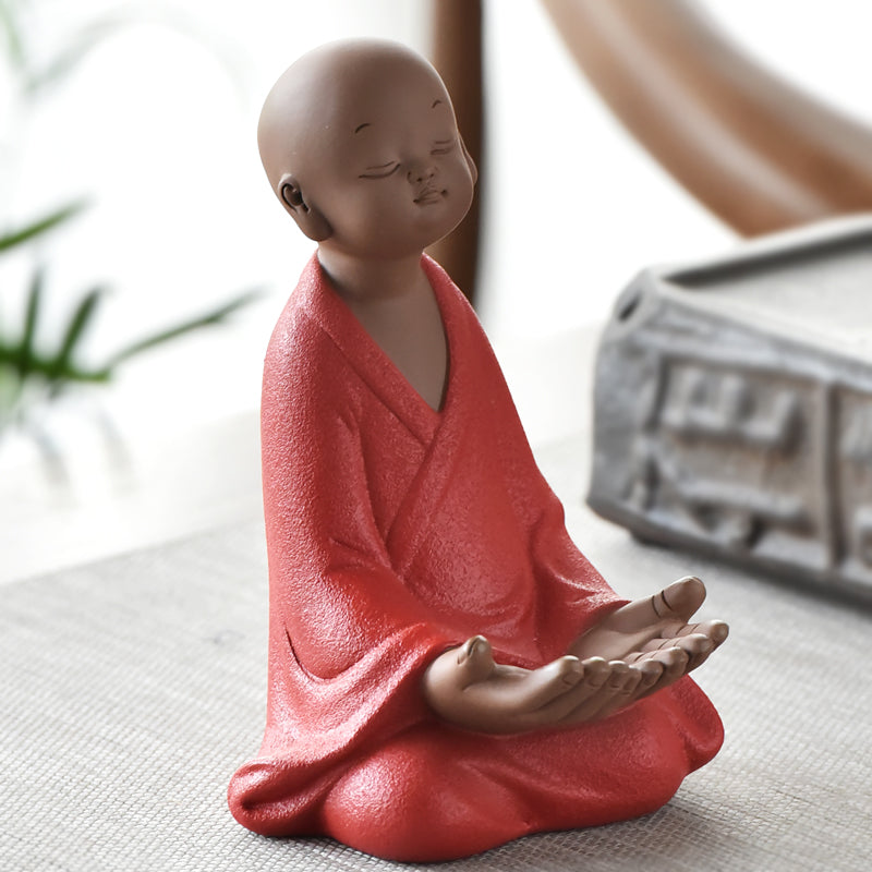 Little monk with a phone stand